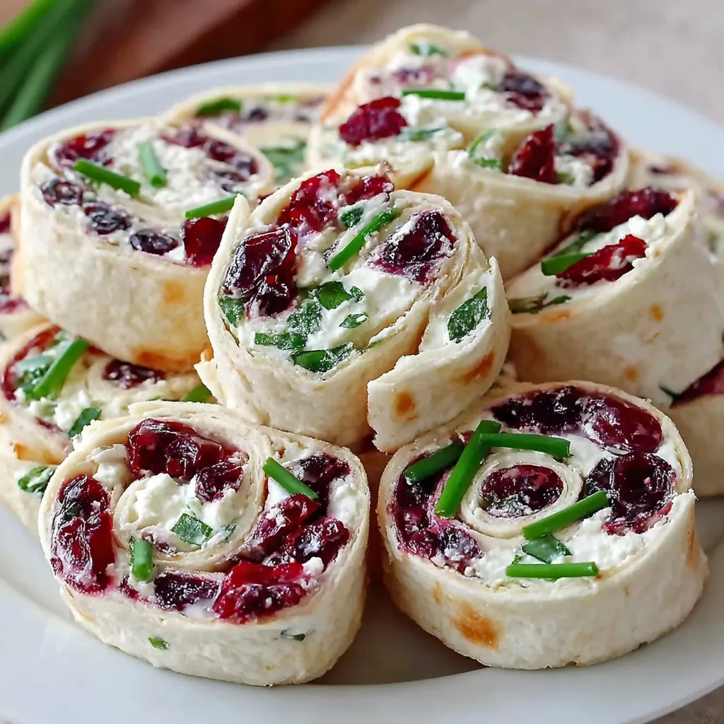 A plate of cranberry feta pinwheels.