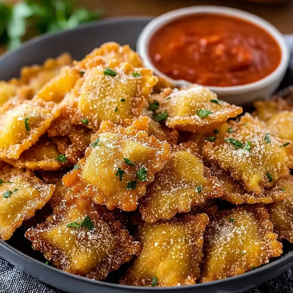 A bowl of crispy Parmesan Ravioli.