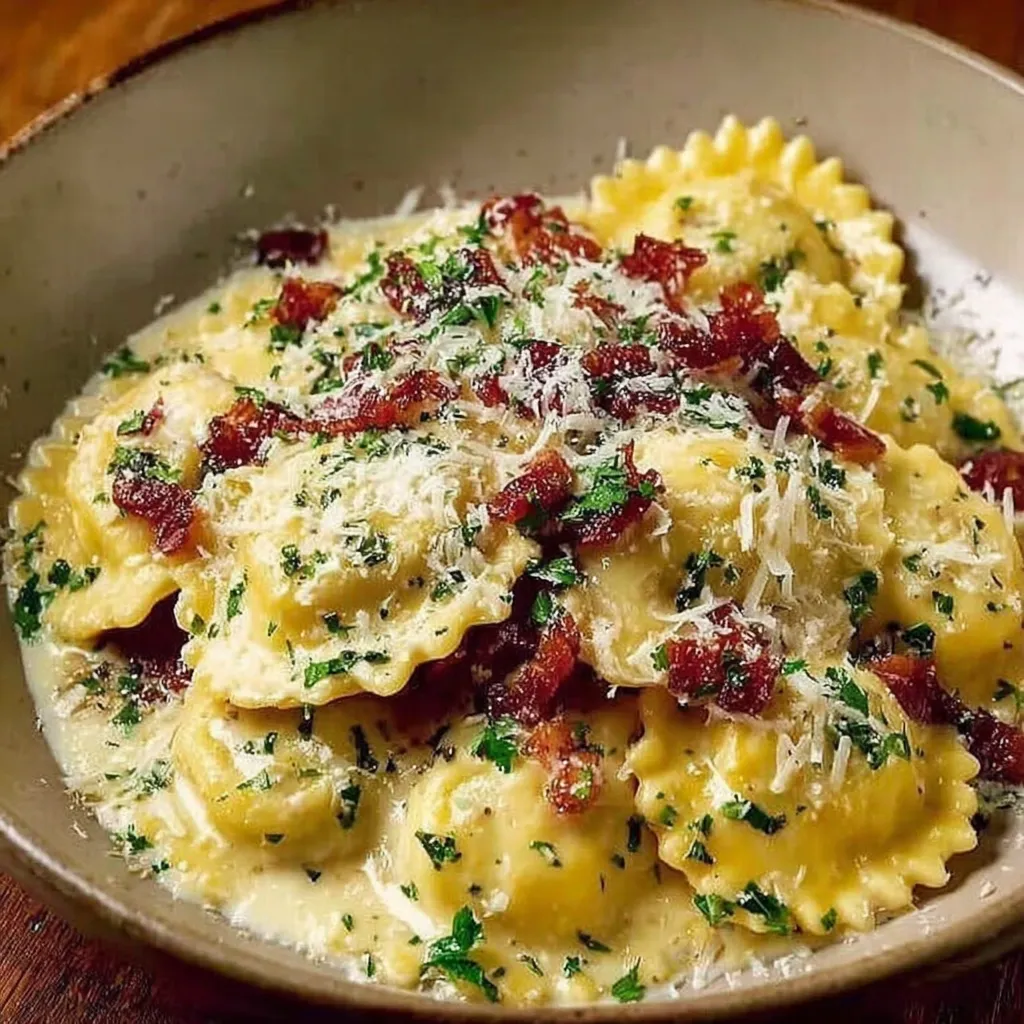 A bowl of pasta with cheese and bacon.