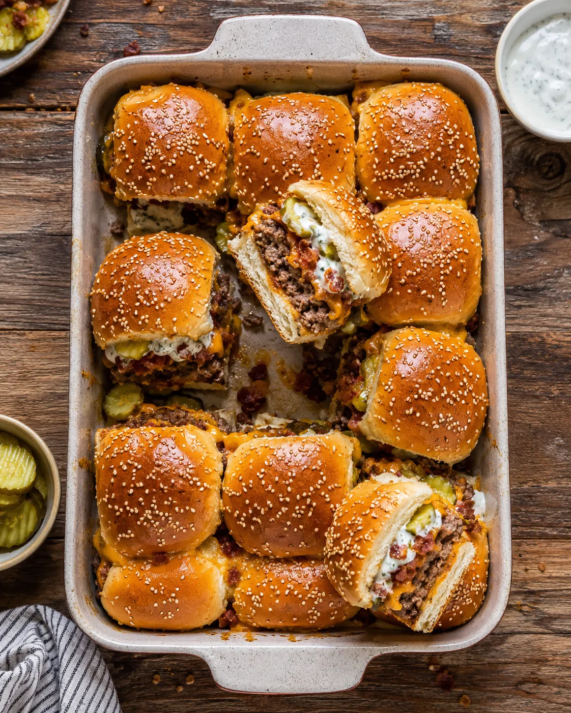 A tray of bacon cheeseburger pickle ranch sliders.