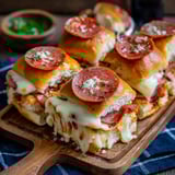 A plate of cheesy pizza sliders.