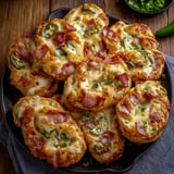 A plate of cheesy party bites.