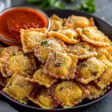 A bowl of crispy Parmesan ravioli.