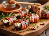 Bacon-wrapped dates with cheese and honey.