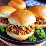 A plate of sandwiches with meat and lettuce.